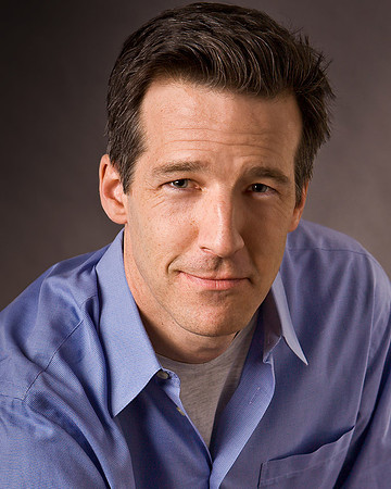 03-Handsome-brunette-male-actor-legit-headshot-dark-background