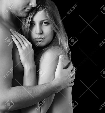 16381789-Beautiful-young-pair-on-a-black-background-Stock-Photo-sexy-couple-romantic